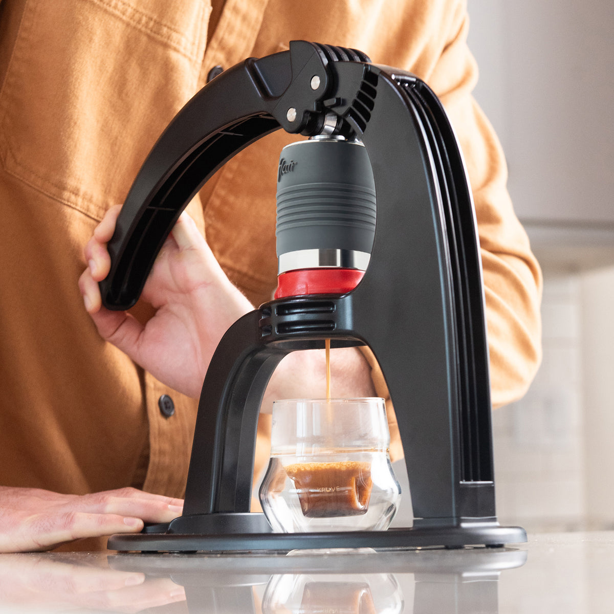 Flair NEO Flex lever being pressed during espresso extraction
